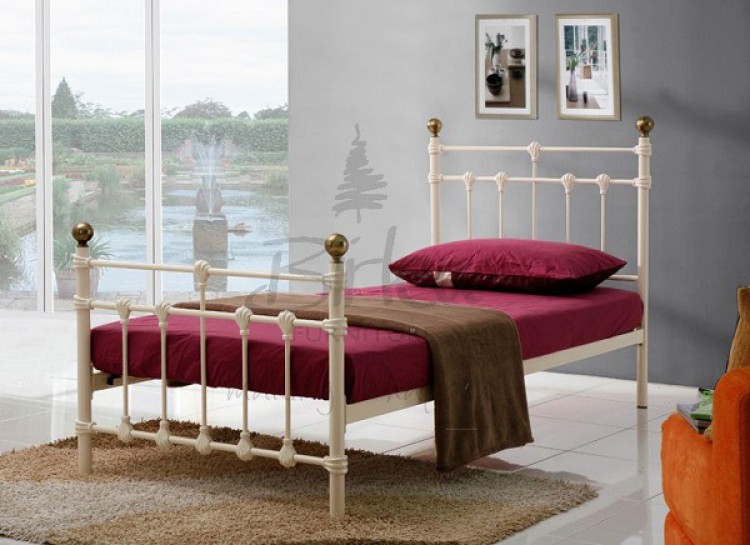 cream metal bed frame and mattress